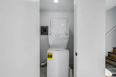 a washer and dryer sitting on top of a refrigerator at Jewell Street Gems Two homes in one in San Diego