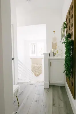 a room with white walls and a wooden floor at Relaxing Mission Beach Getaway - 300ft to sand in San Diego
