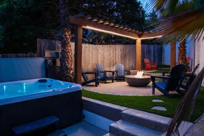 a backyard with a hot tub and a pergola at Charming Urban Escape Near Balboa Park & Airport in San Diego