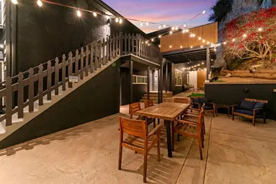 a patio with a table and chairs and a staircase at Charming Urban Escape Near Balboa Park & Airport in San Diego