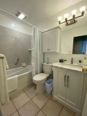 a bathroom with a toilet and a tub and a sink at Relax and Recharge here Close to All Attractions in San Diego