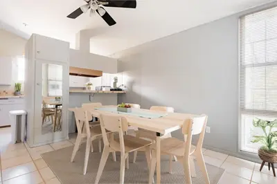 a dining room with a wooden table and chairs at Relax and Recharge here Close to All Attractions in San Diego