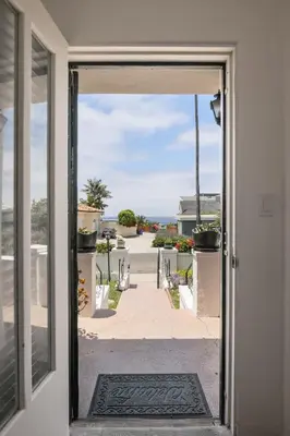an open door with a view of a walkway at Bird Rock, La Jolla Whitewater with AC in La Jolla