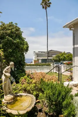 a statue of a woman sitting in a fountain at Bird Rock, La Jolla Whitewater with AC in La Jolla