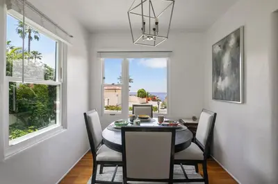a dining room with a table and chairs and a window at Bird Rock, La Jolla Whitewater with AC in La Jolla