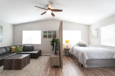 a bedroom with a bed and a ceiling fan at Modern Loft Retreat - North Park San Diego in San Diego