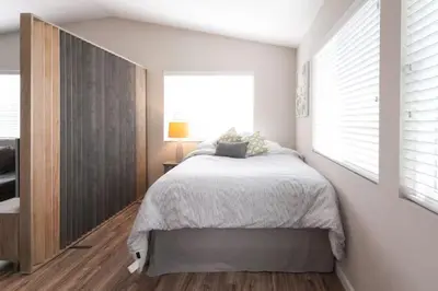 a bedroom with a large bed and a window at Modern Loft Retreat - North Park San Diego in San Diego