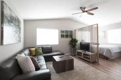 a living room with a couch and a bed at Modern Loft Retreat - North Park San Diego in San Diego