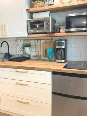 a kitchen with a counter top with a stove and microwave at New cozy studio 2 queen beds kitchen walk to water! in San Diego