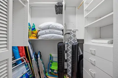 a walk in closet filled with lots of skis at Top of the Wave - DMST31 in Solana Beach
