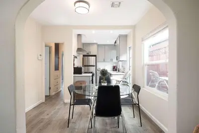 a dining room and kitchen with a table and chairs at Centra Spacious Villa in San Diego