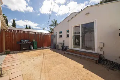 an empty patio next to a house with a fence at Centra Spacious Villa in San Diego