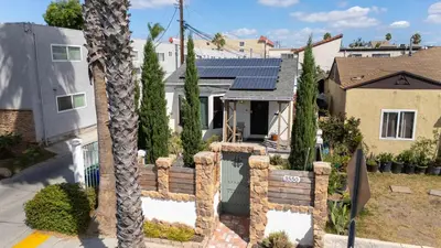 a house with solar panels on the roof at Centra Spacious Villa in San Diego