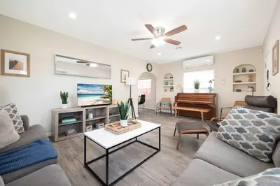 a living room with a couch and a piano at Centra Spacious Villa in San Diego