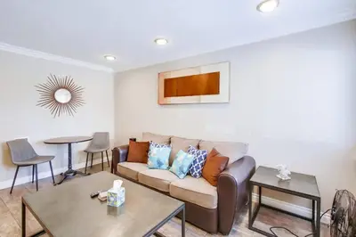 a living room with a couch and a table at Mission Bay Getaway - Walk to the Water in San Diego