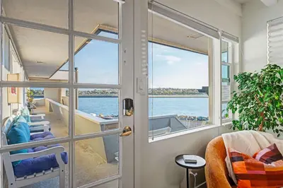 a room with a door with a view of the water at Mission Beach Gem - 1BR Near the Ocean in San Diego