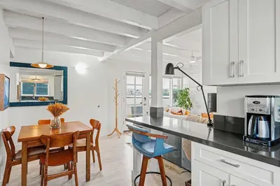 a kitchen and dining room with a table and chairs at Mission Beach Gem - 1BR Near the Ocean in San Diego
