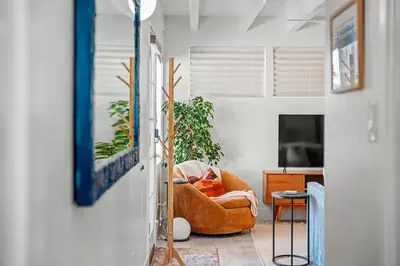 a living room with a couch and a tv at Mission Beach Gem - 1BR Near the Ocean in San Diego