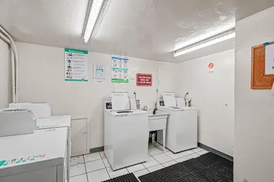 a white room with three machines and a counter at Mission Beach Gem - 1BR Near the Ocean in San Diego