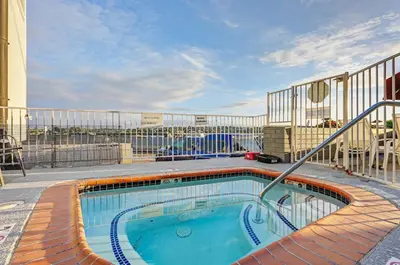 a swimming pool on a balcony of a building at Mission Beach Gem - 1BR Near the Ocean in San Diego
