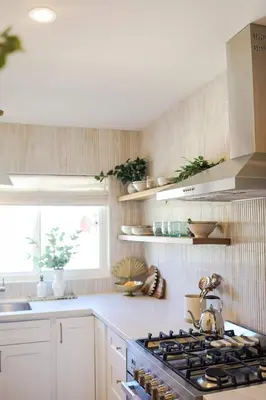 a kitchen with a stove and a sink and a window at The Swell Oceanview Designer Stay Hot Tub in Oceanside