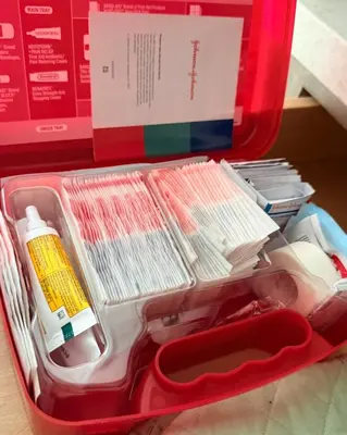 a red container filled with utensils and a box at 2-bedroom apartment Central San Diego! in San Diego