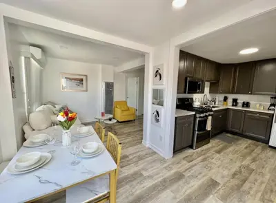 a kitchen and living room with a table and chairs at 2-bedroom apartment Central San Diego! in San Diego