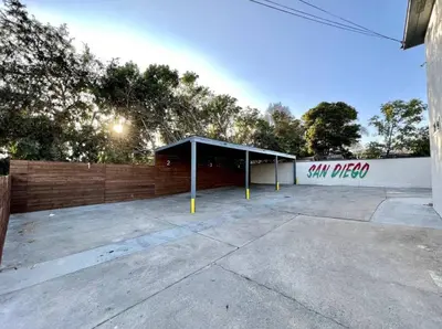 a parking lot with asan pizza sign on a building at 2-bedroom apartment Central San Diego! in San Diego