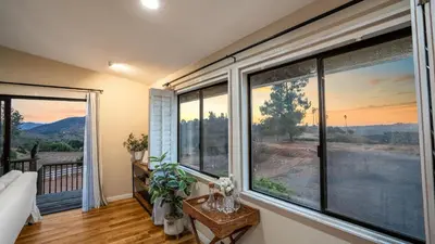 a room with a large window with a view at Scenic Deck w Sunset Views Near Temecula Wineries Estrada Ranch by AvantStay in Fallbrook