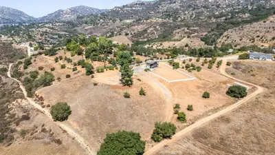 an aerial view of a park with trees on a hill at Scenic Deck w Sunset Views Near Temecula Wineries Estrada Ranch by AvantStay in Fallbrook