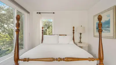 a bedroom with a bed and a window at Two Estates w Pools Hot Tubs Game Rooms Valley Views Tennis Court Near Beaches Wineries in Escondido