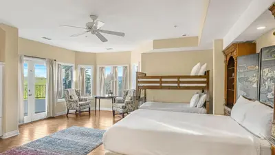 a bedroom with two beds and a ceiling fan at Two Estates w Pools Hot Tubs Game Rooms Valley Views Tennis Court Near Beaches Wineries in Escondido