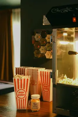 a popcorn machine with popcornsticks and a container of popcorn at Wild Moon Ranch with Pickleball, Cedar Tub, Views in Julian