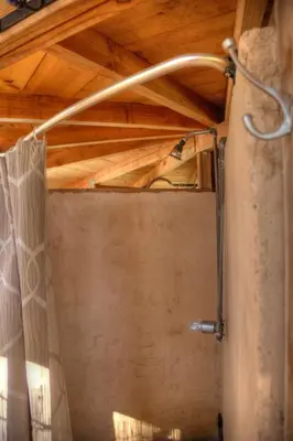 a shower in a bathroom with a wooden ceiling at Group Bunkhouse Sleeps 12 Mountain Views in Palomar Mountain