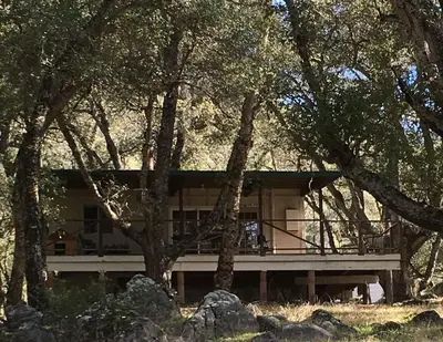 a house in the middle of some trees at Harrison Serenity Ranch - Groups over 50 in Palomar Mountain