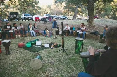 a group of people sitting around in a park at Cozy Rustic Mountain Home with Breathtaking views in Palomar Mountain