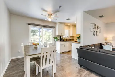 a kitchen and living room with a table and a couch at Pet-Friendly Apt 11 Mi to Dtwn San Diego! in Spring Valley