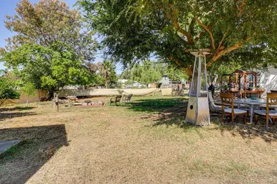 a table and chairs under a tree in a park at Pet-Friendly Apt 11 Mi to Dtwn San Diego! in Spring Valley