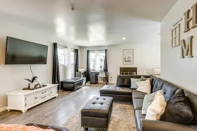 a living room with a couch and a tv at Pet-Friendly Apt 11 Mi to Dtwn San Diego! in Spring Valley