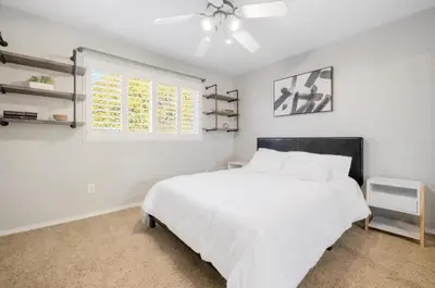 a bedroom with a white bed and a window at HUGE 5BR Family Retreat Backyard & Patio Lounge in Santee
