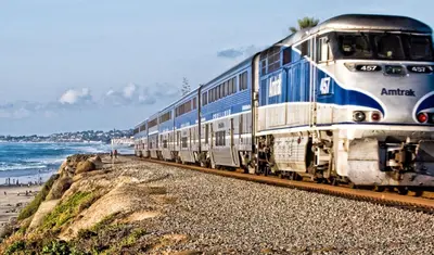 a train on the tracks next to the beach at Retro Star-Wagon, Ocean Breez at Studios in Oceanside