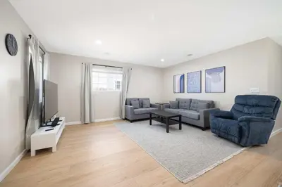 a living room with two couches and a tv at Cozy Pet Friendly Escape with Outdoor Dining in San Diego