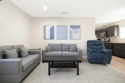 a living room with a couch and a chair at Cozy Pet Friendly Escape with Outdoor Dining in San Diego