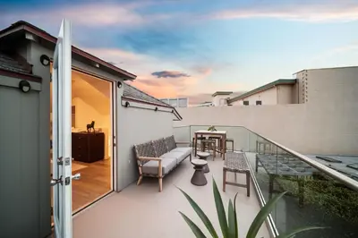 a balcony with a table and chairs on it at Terrace Views at La Jolla Cove in San Diego