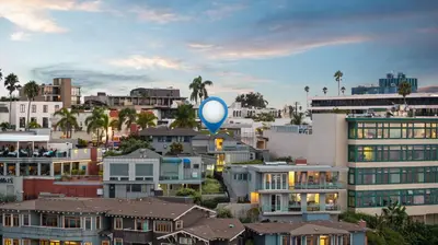 a blue balloon flying over a city with houses at Terrace Views at La Jolla Cove in San Diego