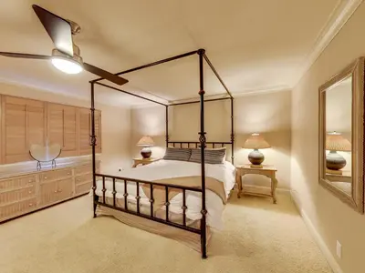 a bedroom with a bed and a ceiling fan at Solana Oceanfront with Pool, Spa, Ocean Views in Solana Beach