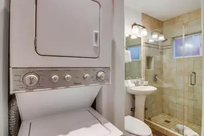 a bathroom with a toilet and a sink and a shower at South Shore Dream with Ocean View, Large Patio, BBQ in San Diego