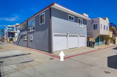 a gray house with a white garage at South Shore Dream with Ocean View, Large Patio, BBQ in San Diego