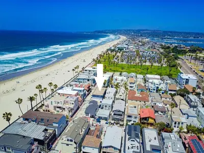 an aerial view of a beach with palm trees and houses at South Shore Dream with Ocean View, Large Patio, BBQ in San Diego