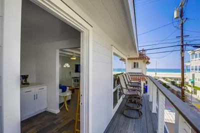 a balcony with chairs and a view of the ocean at South Shore Gem with Ocean View, Patio, BBQ in San Diego